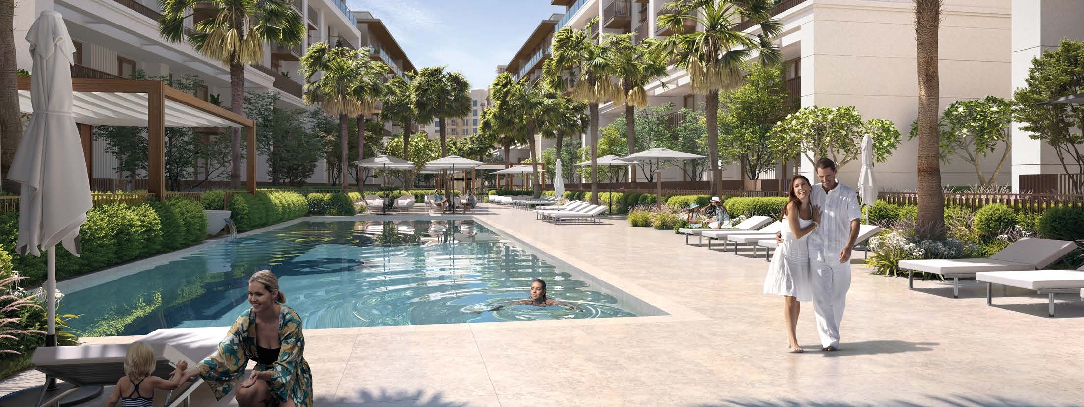 SHIMMERING POOL SURROUNDED BY LUSH LANDSCAPE